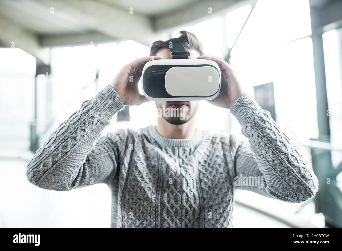 Developer using virtual reality headset at robotic Stock Photo