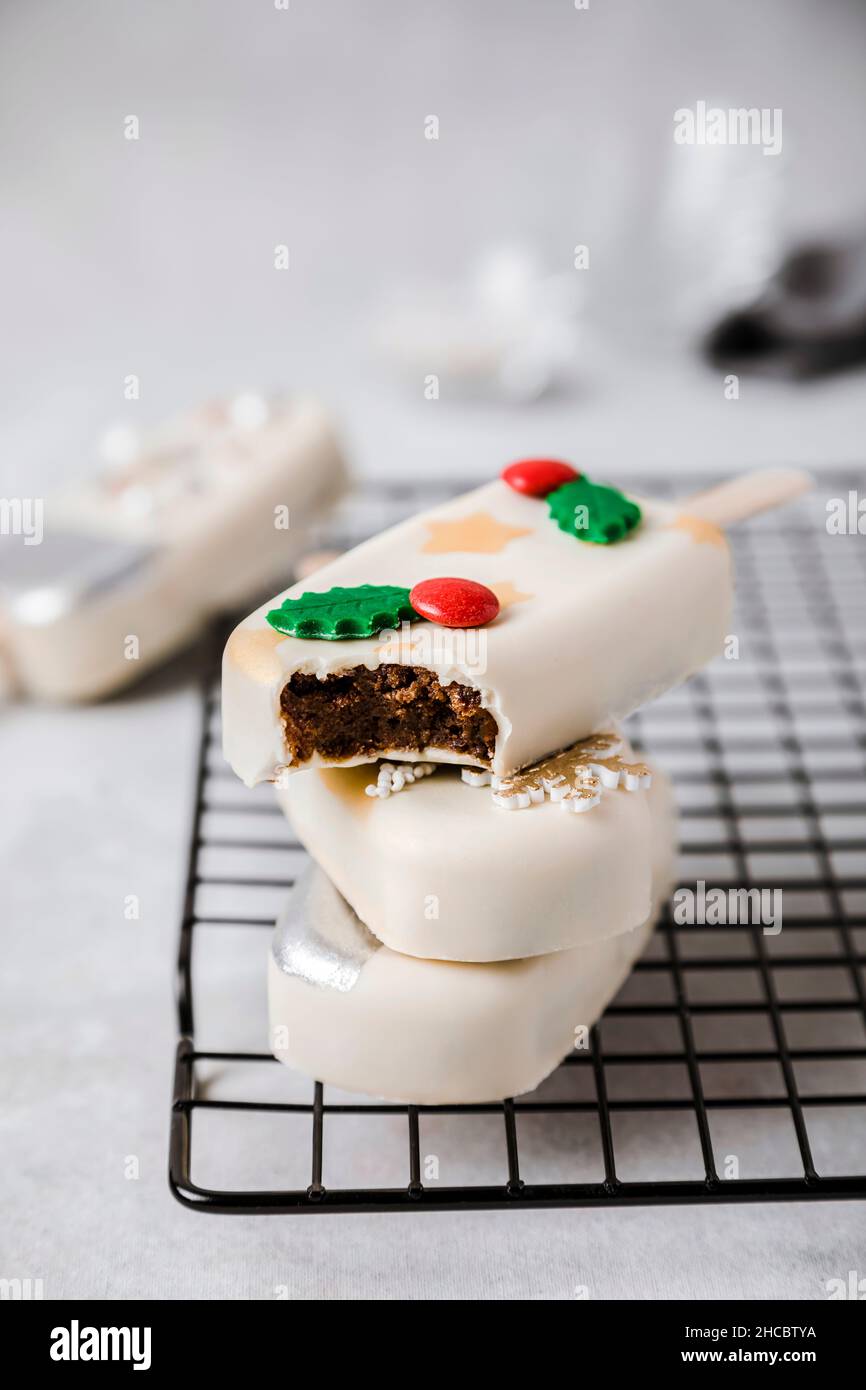 Christmas decorated cake pops on cooling rack Stock Photo Alamy