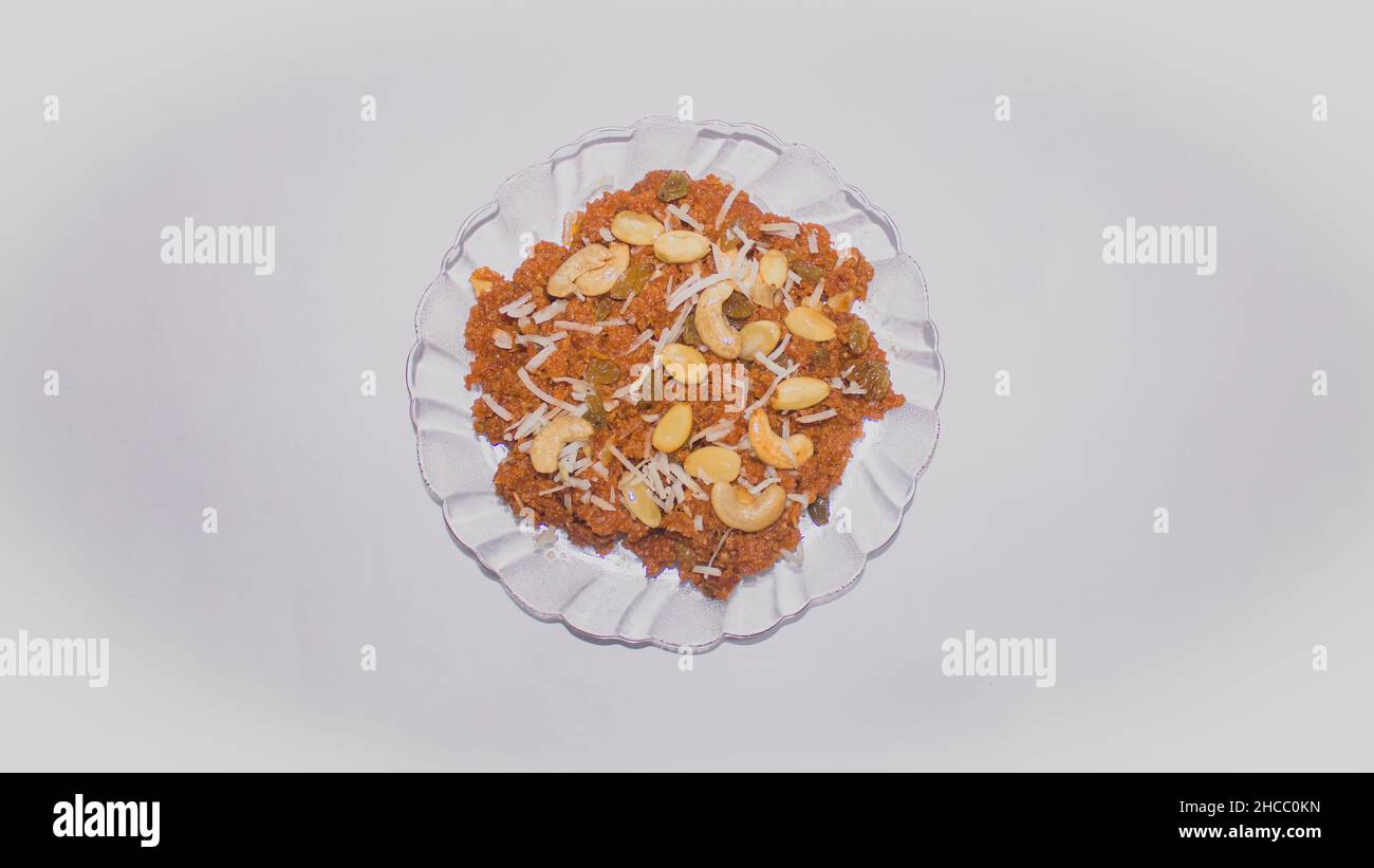 Carrot Halwa or Gajar ka halwa in a glass pot on a white background stock photo space for text Backgrounds, Carrot, Dessert - Sweet Food, Diwali, Halv Stock Photo