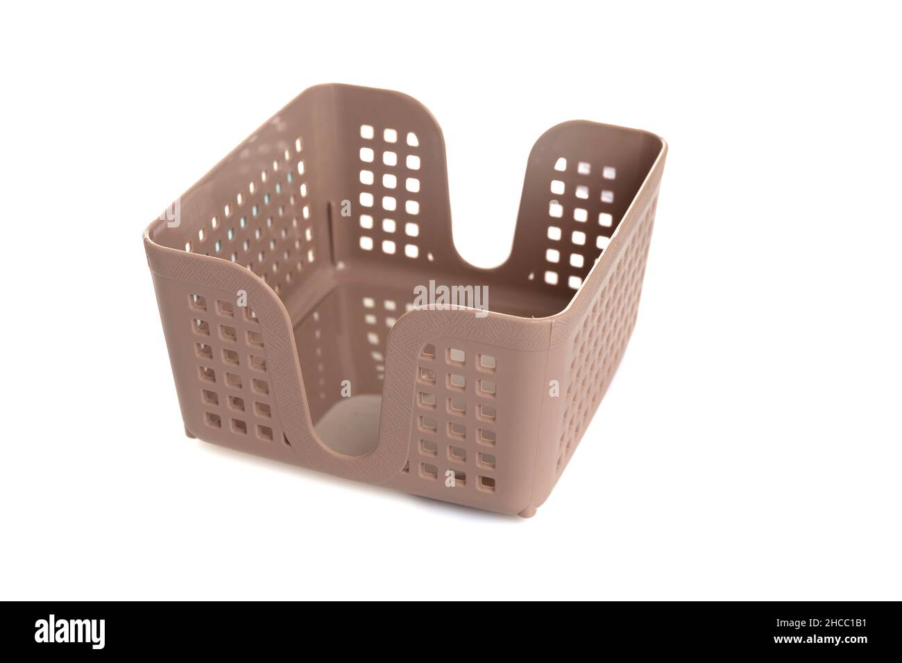 light brown napkin holder plastic empty on white background Stock Photo