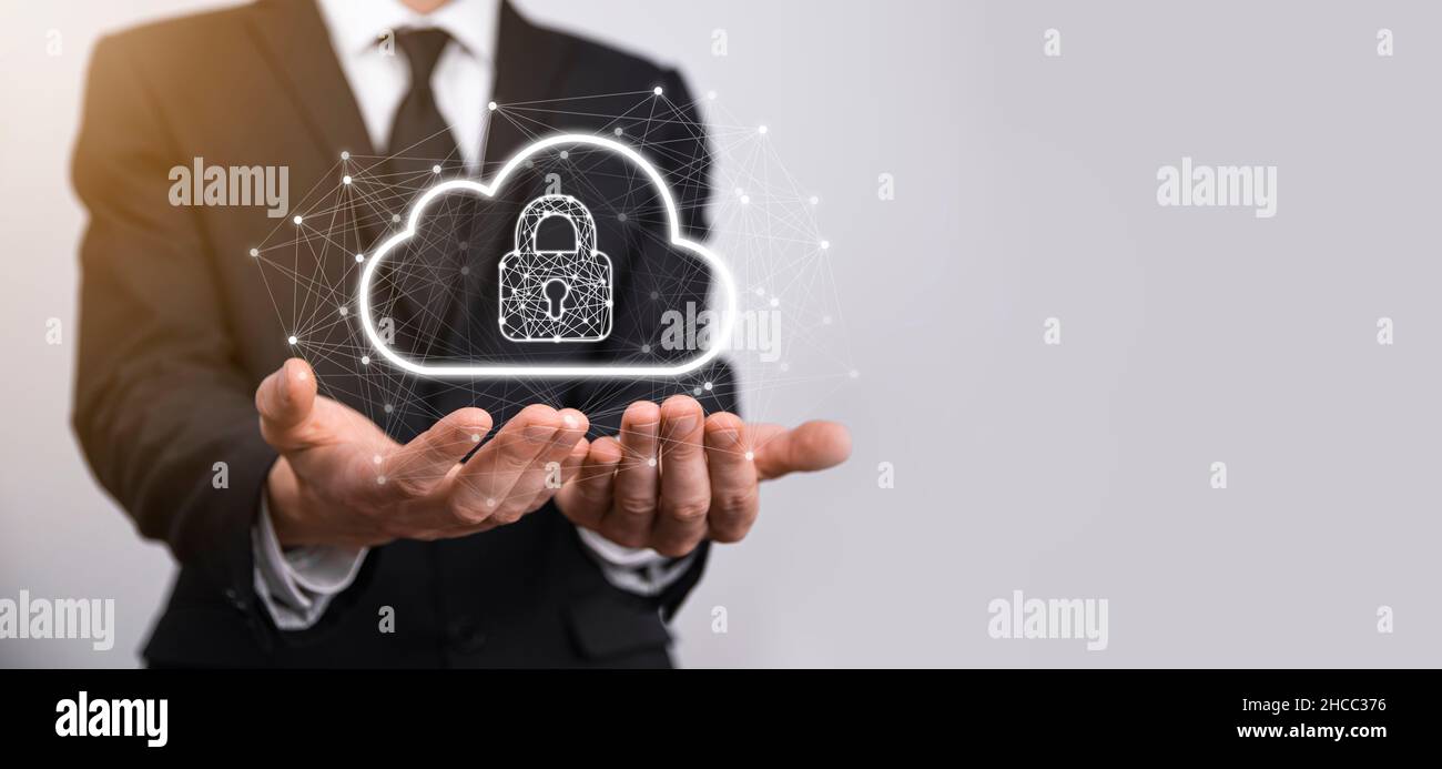 Business man hold,holding cloud computing data and security on global networking,Padlock and cloud icon. Technology of business.Cybersecurity and info Stock Photo