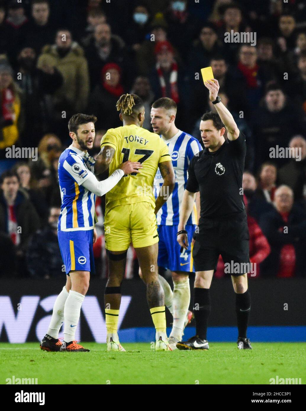 Ivan Toney of Brentford receives a yellow card for simulation from referee Andy Madley during the Premier League match between Brighton and Hove Albion and Brentford at The American Express Community Stadium  , Brighton,  UK - 26th December 2021 - Editorial use only. No merchandising. For Football images FA and Premier League restrictions apply inc. no internet/mobile usage without FAPL license - for details contact Football Dataco Stock Photo