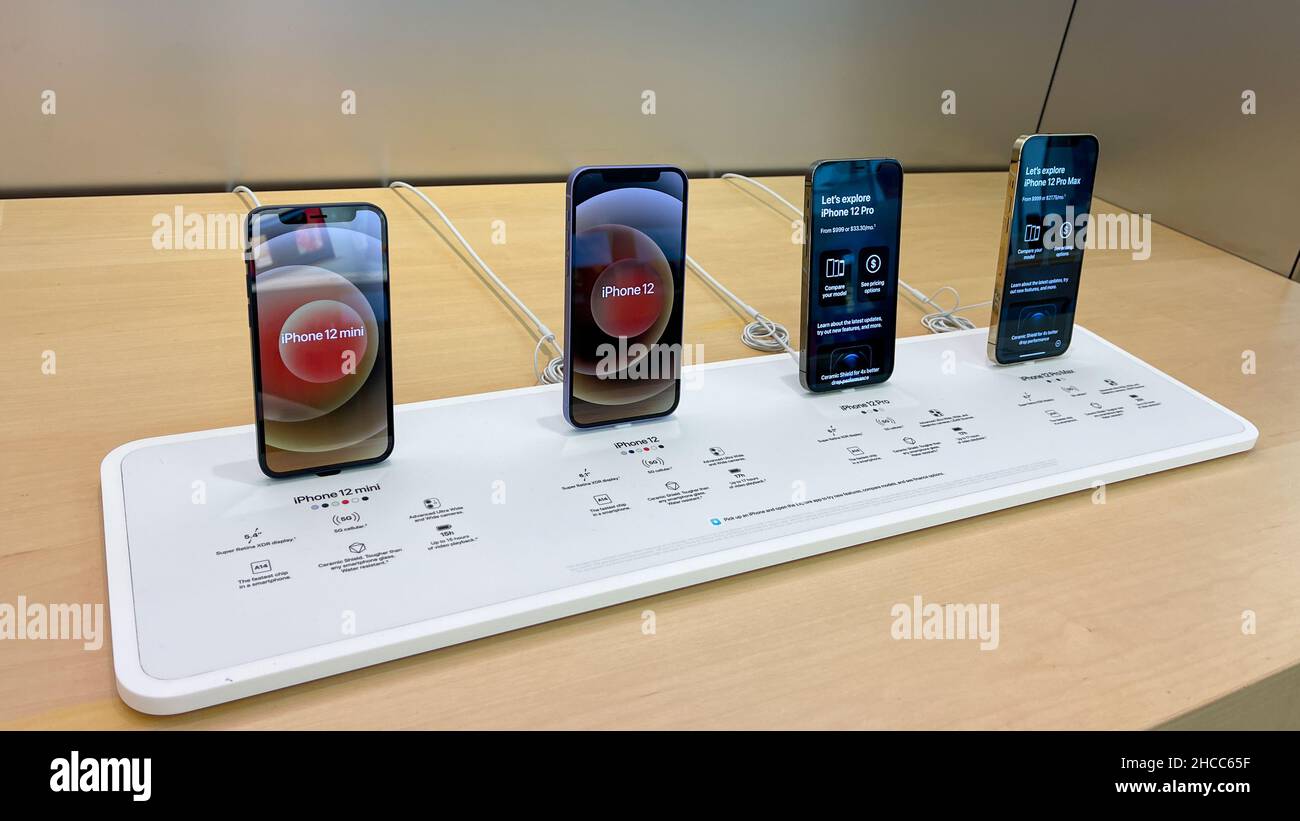 Orlando, FL USA - September 20, 2021:  A row of all of the models of the iPhone 12  at an Apple store. Stock Photo