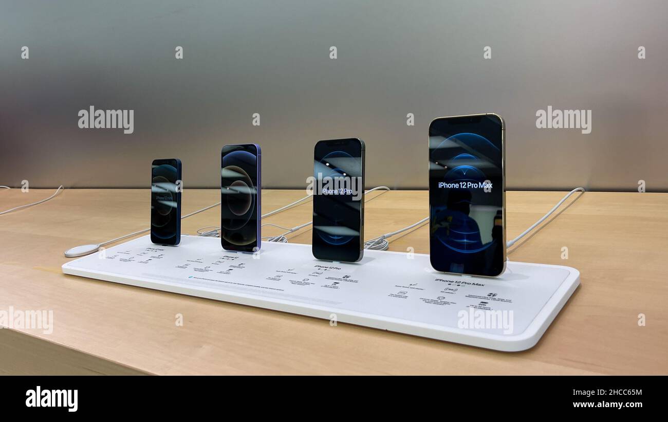Orlando, FL USA - September 20, 2021:  A row of all of the models of the iPhone 12  at an Apple store. Stock Photo