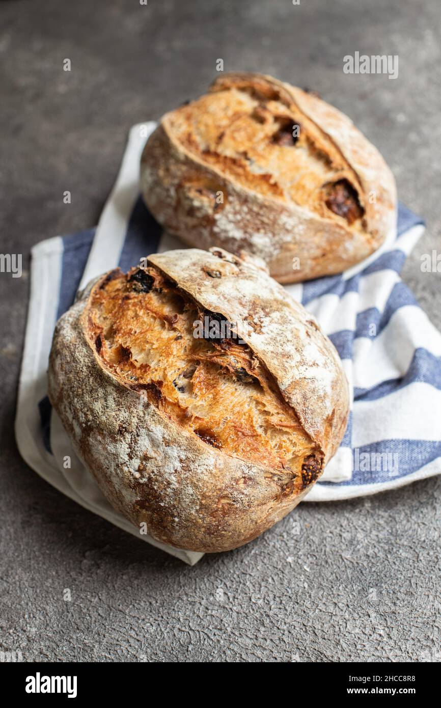 Freshly baked sourdough bread with dried tomatoes. Close up. Stock Photo