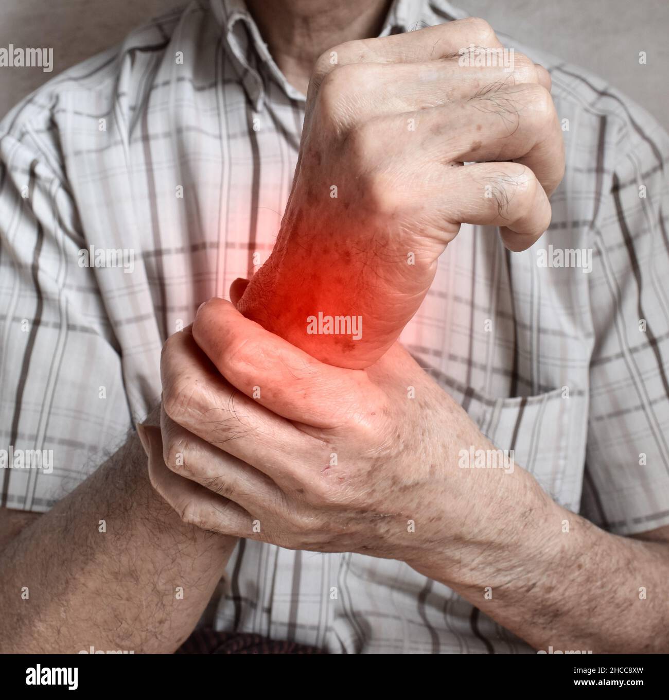 Pain in the wrist joint of Southeast Asian elder man. Concept of hand