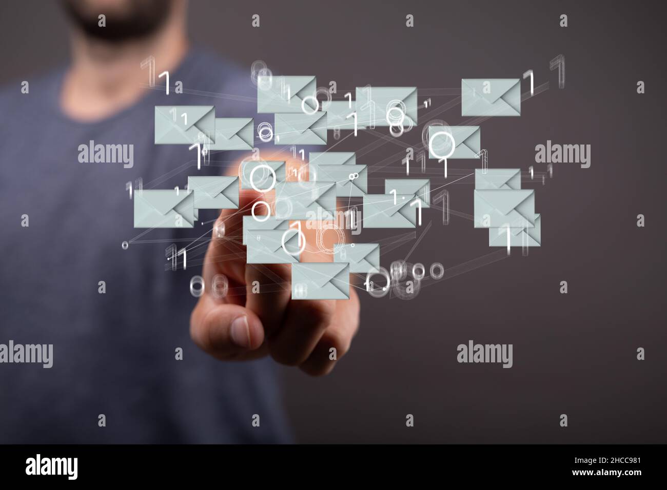 Closeup of the hand pointing at the floating email icons with binary ...