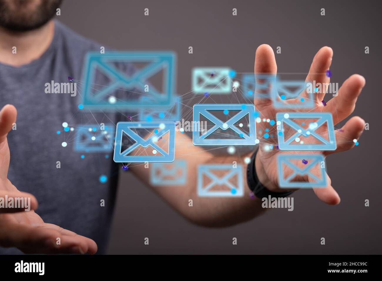 Closeup of the hands holding the floating email icons Stock Photo - Alamy