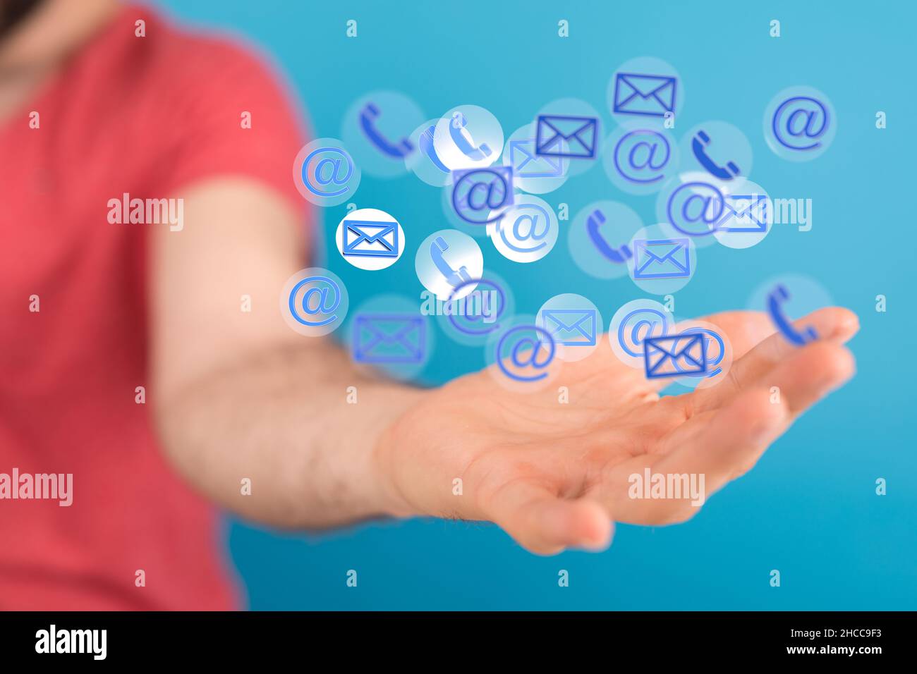 Closeup of the hand holding the floating email icons Stock Photo - Alamy