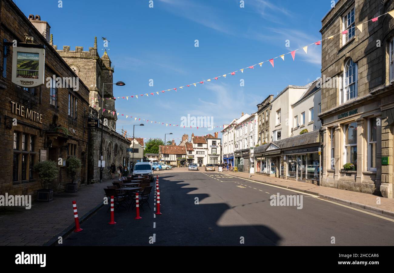 Shaftesbury High Street is decorated with bunting and outdoor seating during the recovery from the Covid-19 pandemic. Stock Photo
