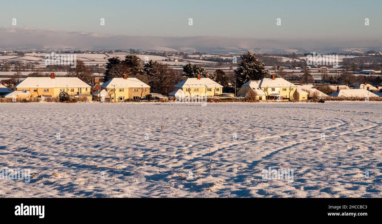 Snow lies on the fields and houses of the Blackmore Vale in Dorset. Stock Photo