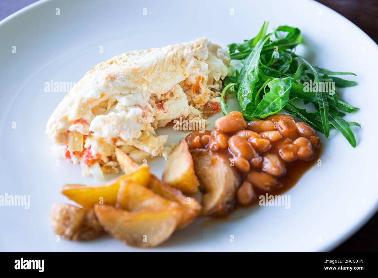 egg white omelette with beans potatoes and salad, healthy breakfast Stock Photo