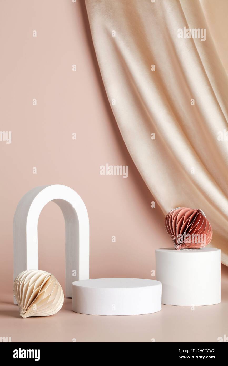 podium for product display on beige background with textile and honeycomb paper decor. product background for Christmas and winter holiday concept.  Stock Photo