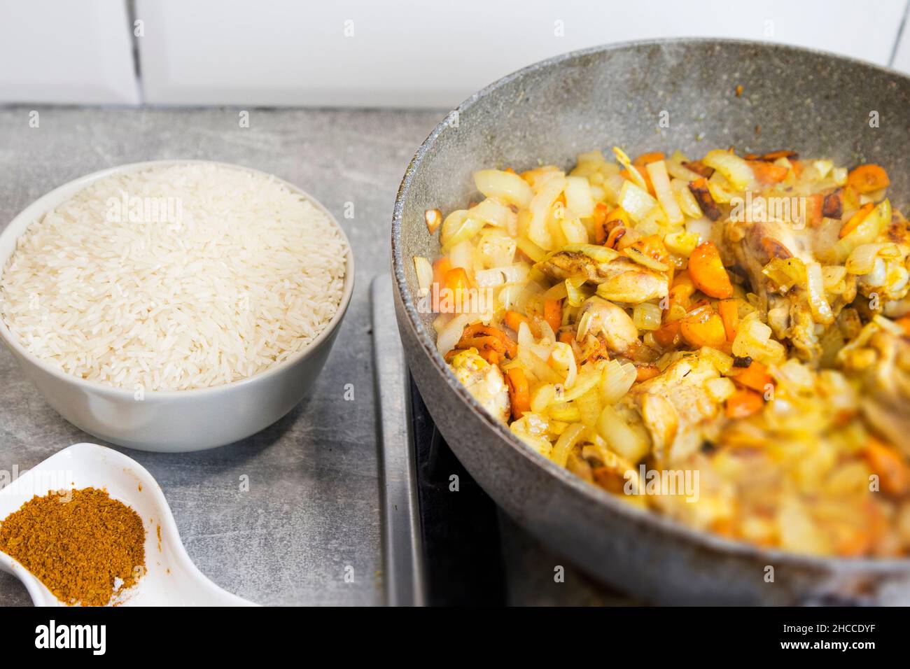 Ingredients for pilaf. Carrots, onion bulbs, rice, sliced meat, salt, barberry, saffron, cumin powder oil Step-by-step cooking process Stock Photo