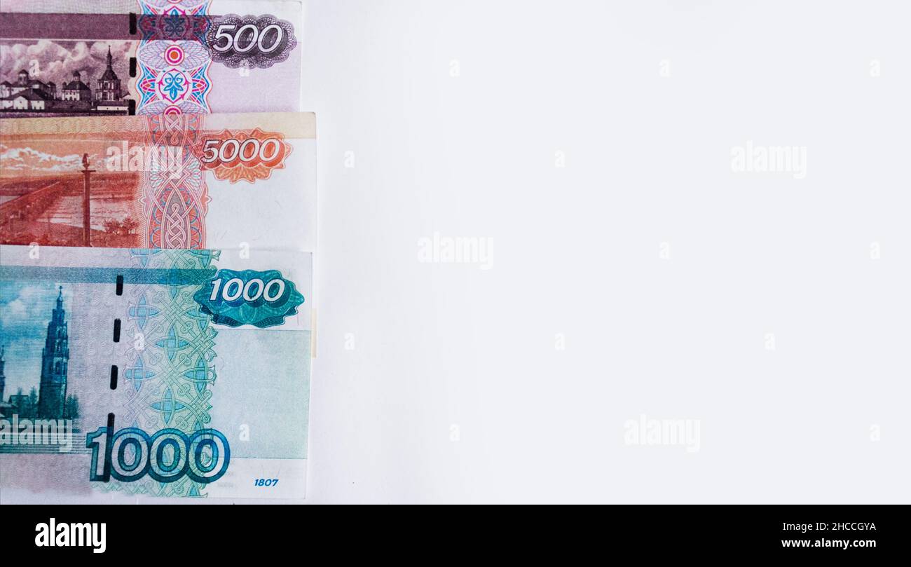 Rusian Notes row of different Russian banknotes on white isolated background. Place ...