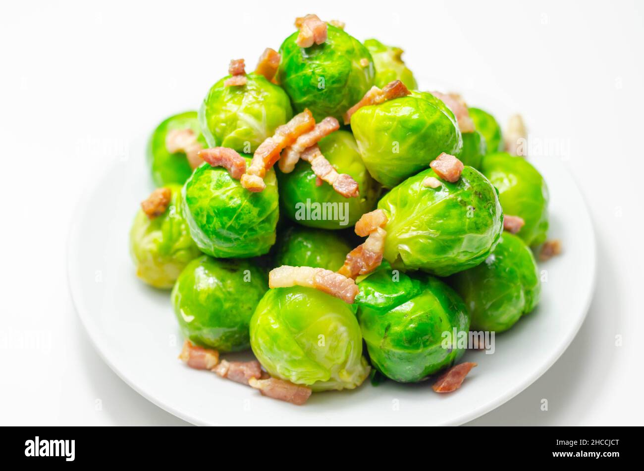 Tasty brussels sprouts with smoked bacon lardons and salted butter