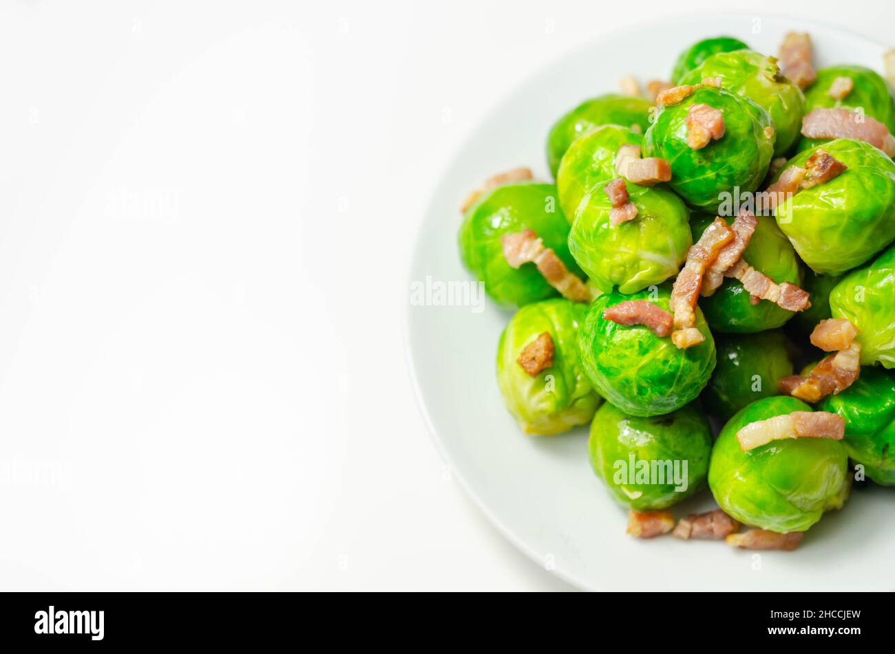 Tasty brussels sprouts with smoked bacon lardons and salted butter