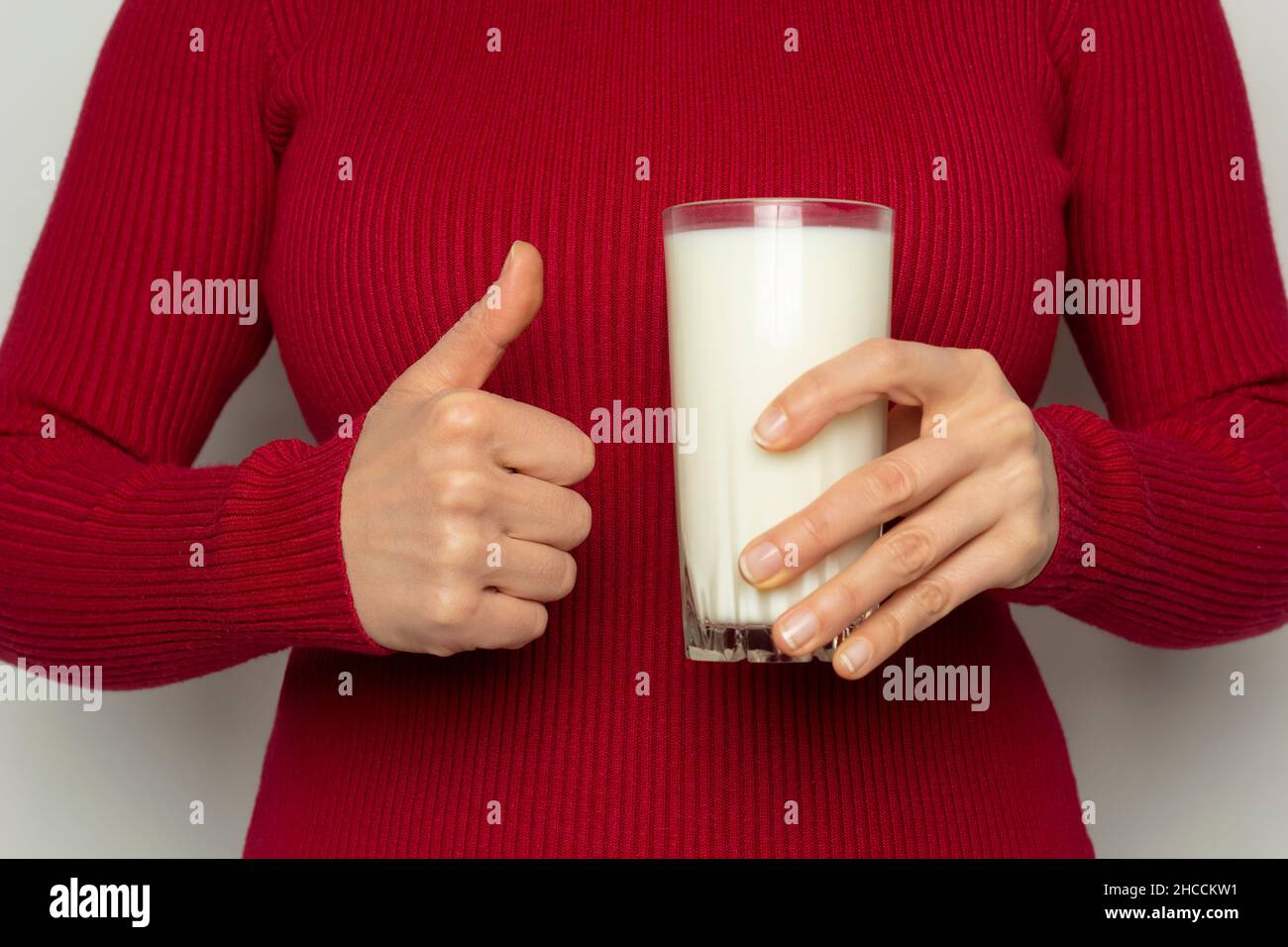 Thumbs up for the benefits of drinking milk Stock Photo