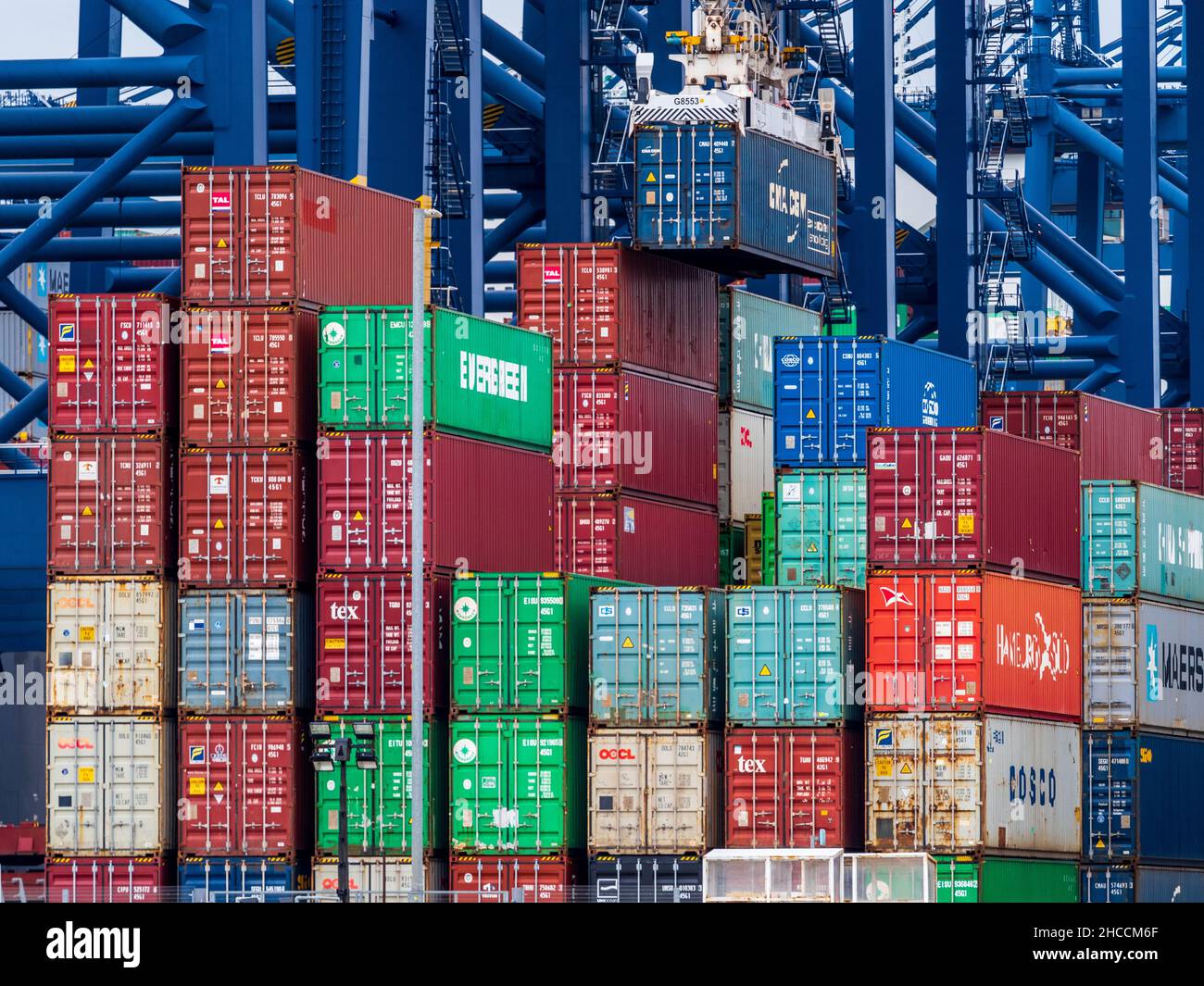 Container Congestion at UK Ports - Stacked shipping containers await collection or onward transit at Felixstowe Port. Stock Photo