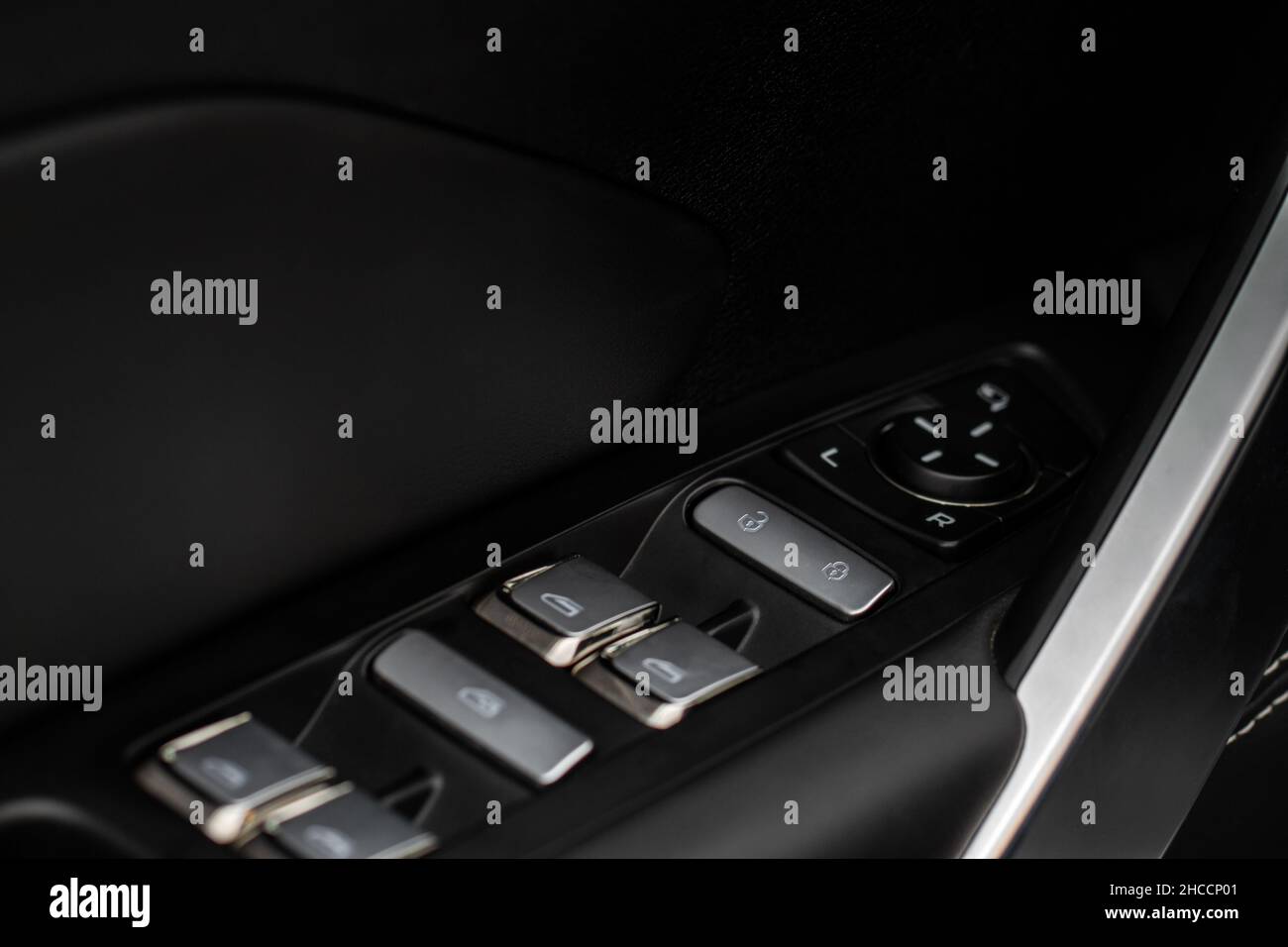 Car door lock switch close up. A car lock button. Car door handle with door lock control Stock