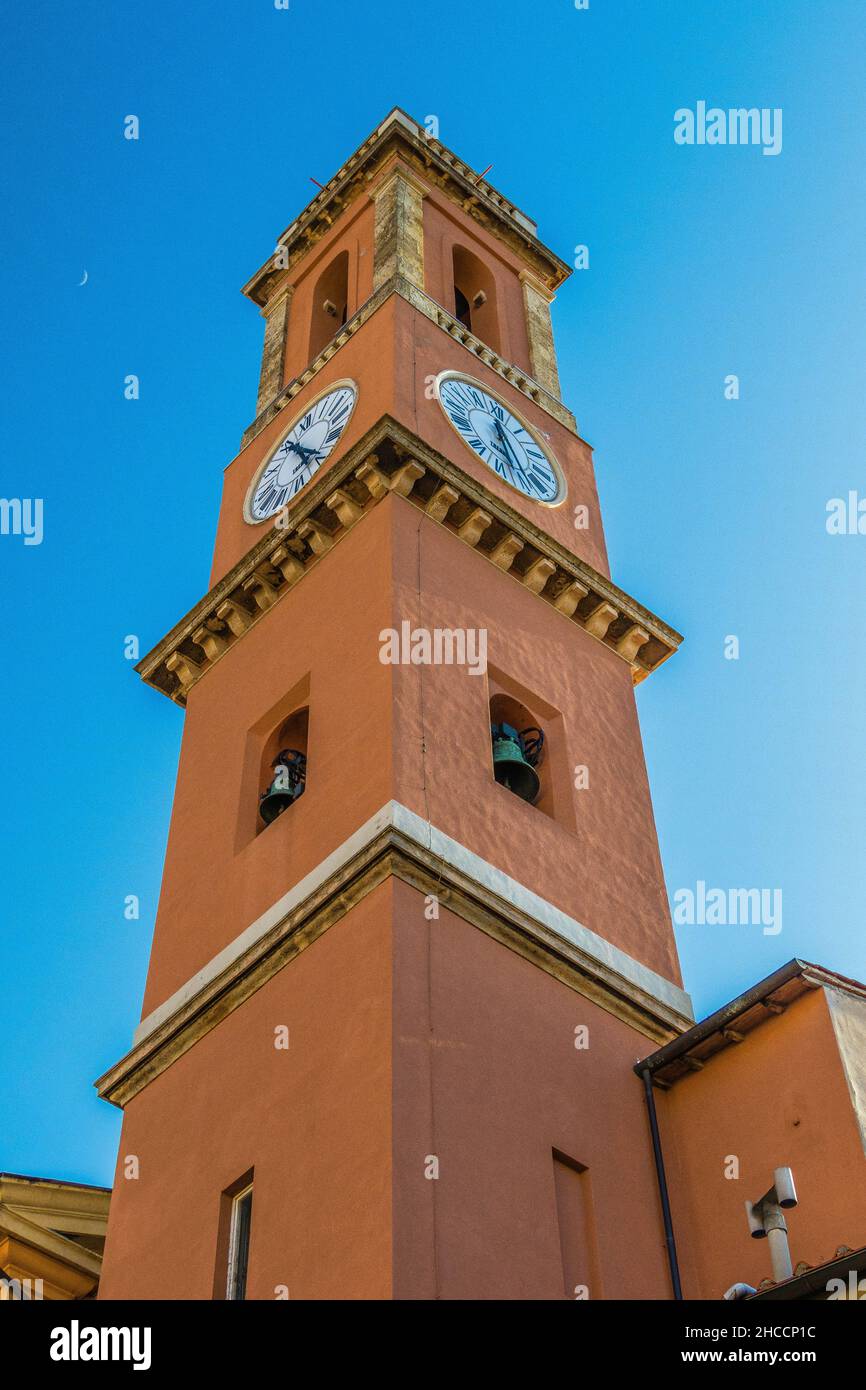 Vertical low angle shot of a clock tower under a bright sky Stock Photo ...