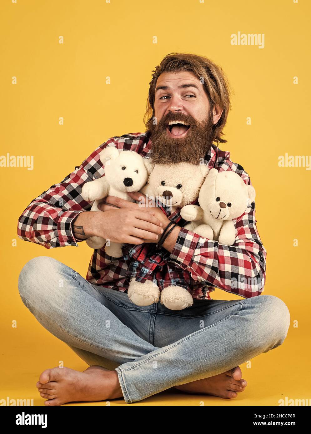 embrace with love. male feel playful with bear. brutal mature hipster man play with toy. happy birthday. being in good mood. happy valentines day Stock Photo