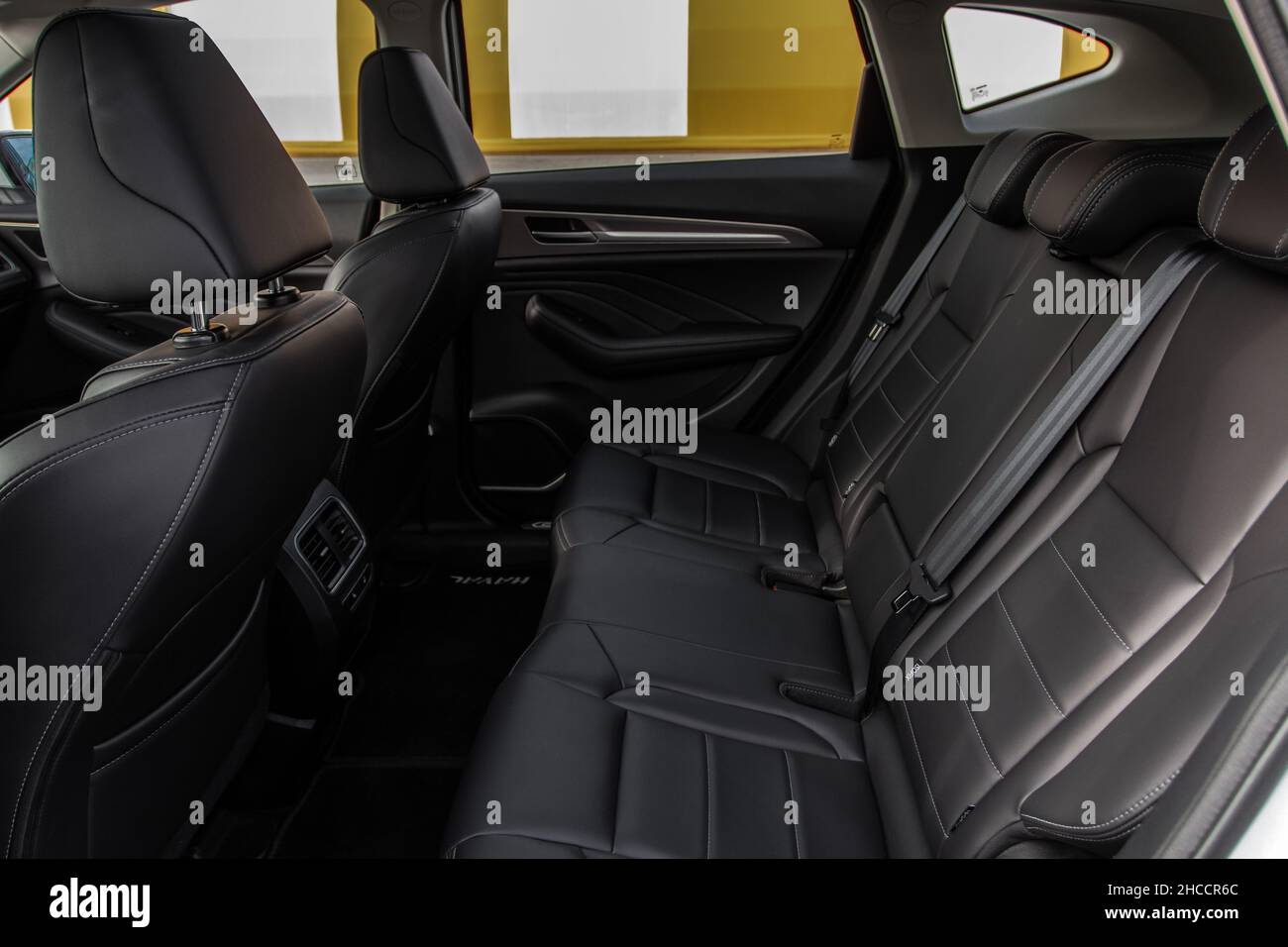 Modern SUV car inside. Leather black back passenger seats in modern