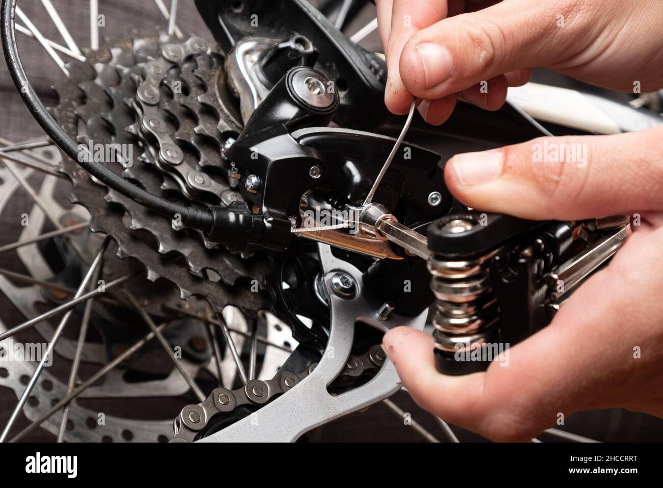 installation of a cable for gear shifting on a bicycle Stock Photo Alamy