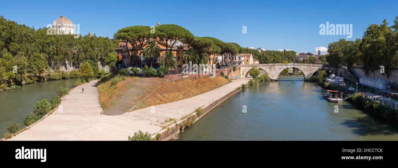 Rome - The panorama of Isola Tiberiana - Tiberian Island with the Ponte Cestio bridge. Stock Photo