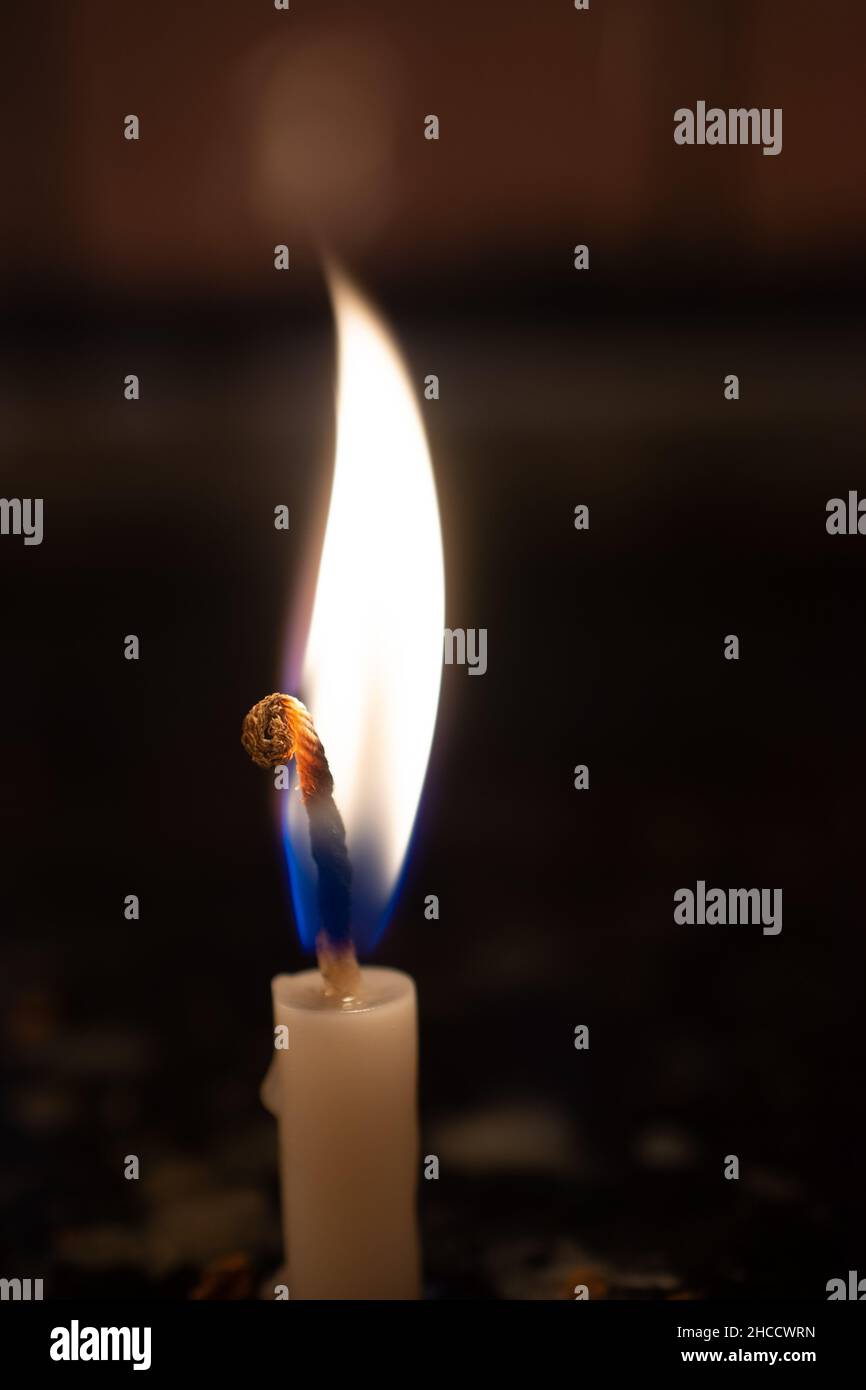 Selective focus shot of a lighted candle Stock Photo