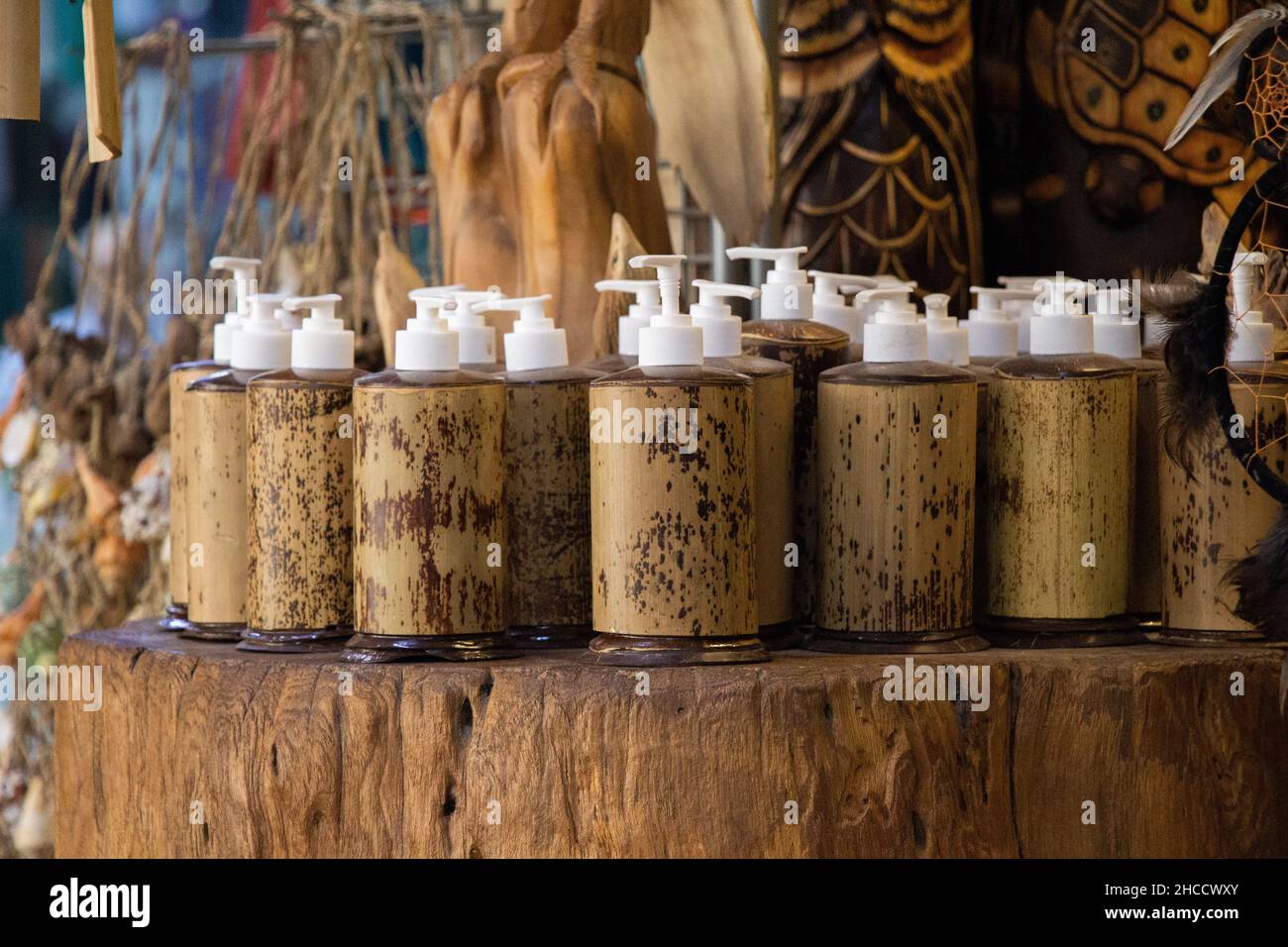 Closeup shot of soap dispensers on a trunk Stock Photo
