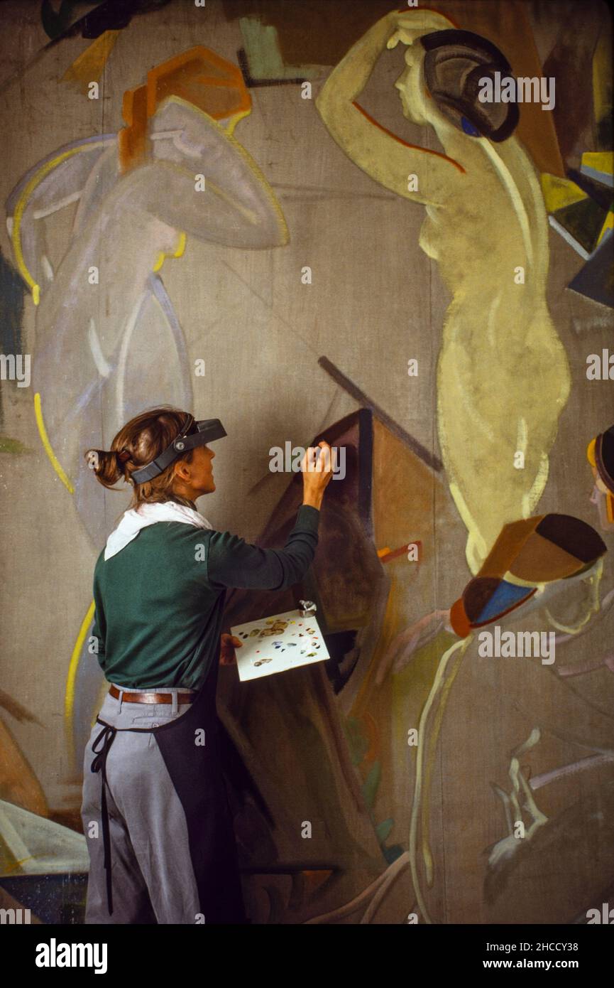 Brooklyn Museum of Art woman conservator restoring a large painting in