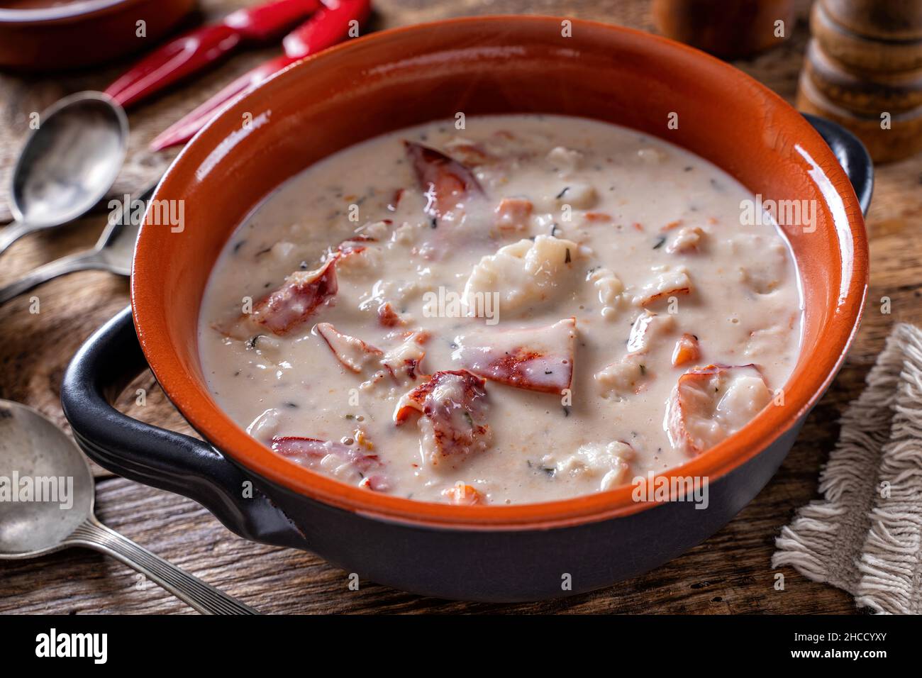 A bowl of hearty delicious lobster chowder. Stock Photo