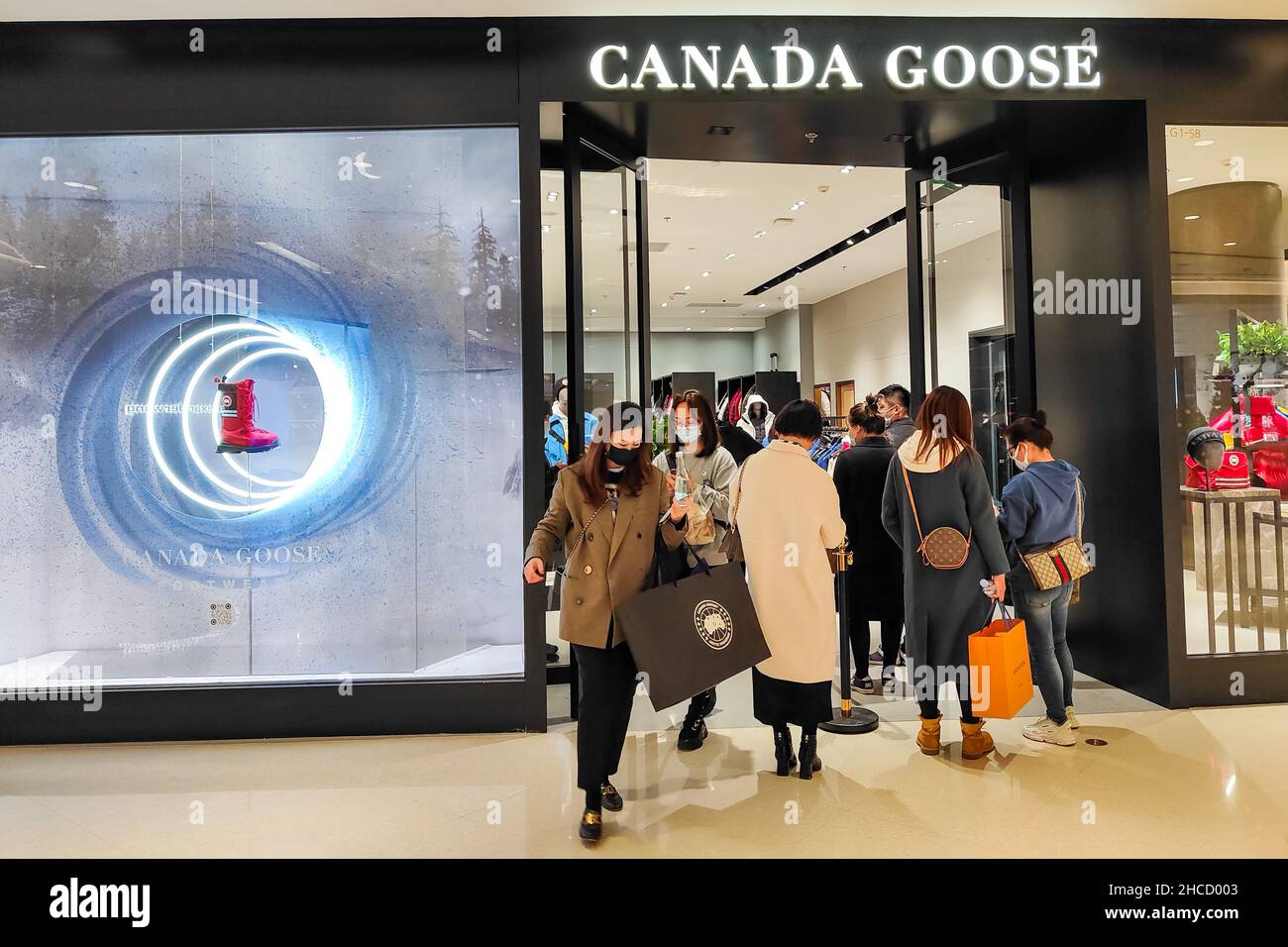 SHANGHAI, CHINA - DECEMBER 2, 2021 - Customers wait in front of a Canada  Goose store on December 2, 2021 in Shanghai, China. The Shanghai Consumer  Protection Commission has called in Canada