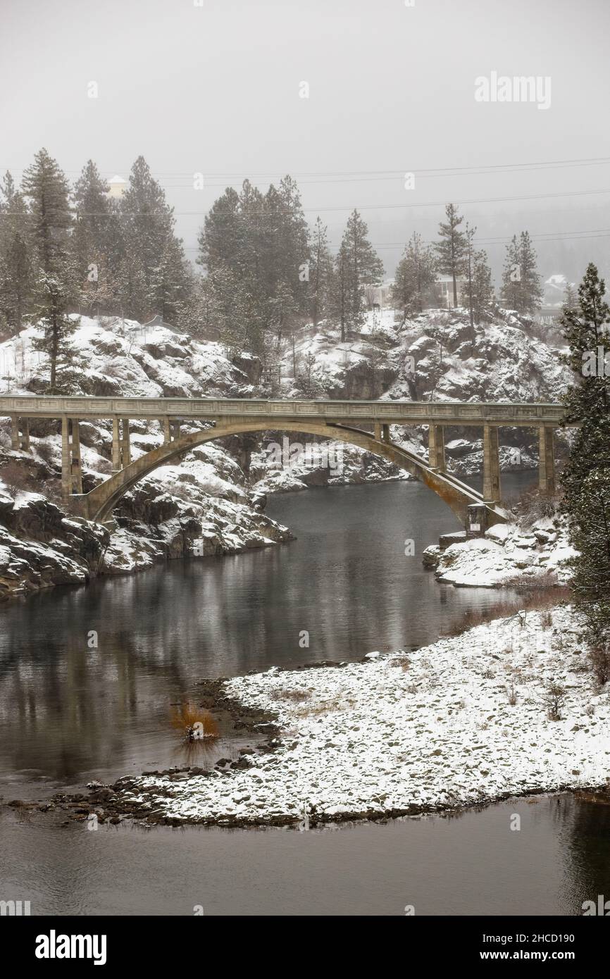 Old bridge spans across the Spokane River during winter in Post Falls