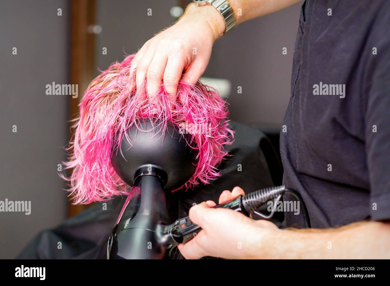Making hairstyle using hair dryer hi-res stock photography and images ...