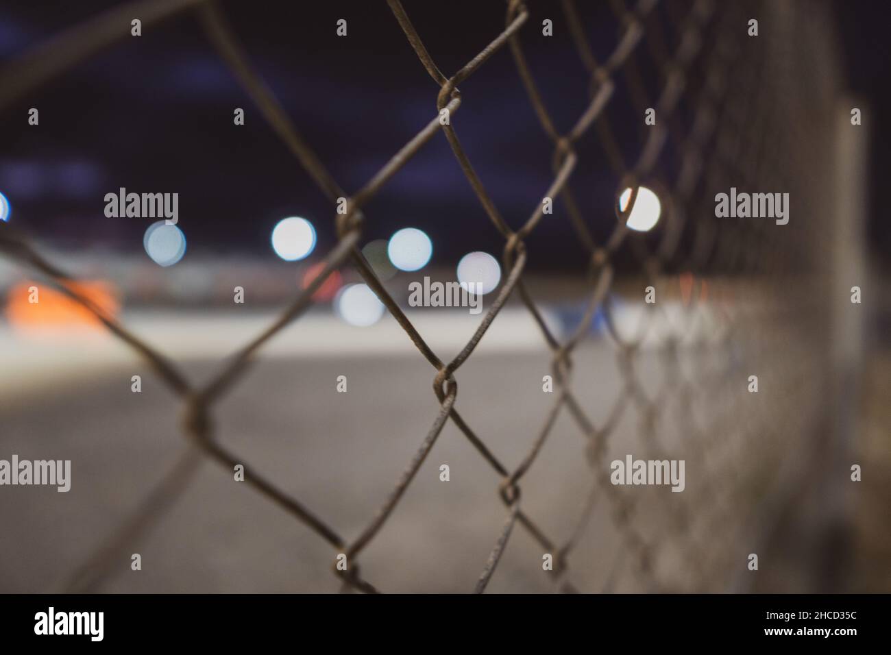 Closeup of a metal wired fence Stock Photo - Alamy