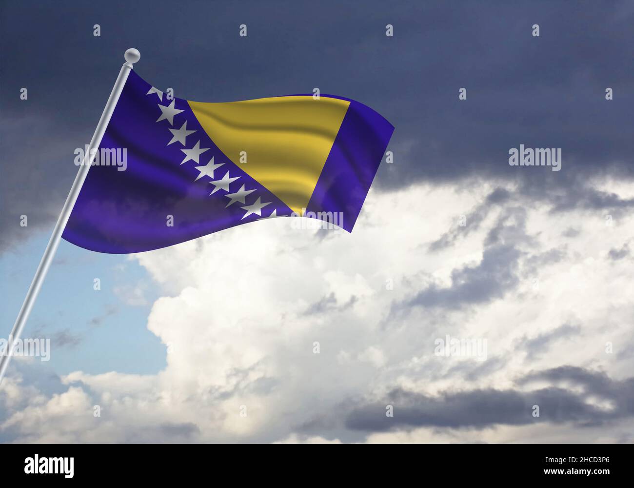 Flag of the Bosnia and Herzegovina on a stick, dark clouds in the background Stock Photo