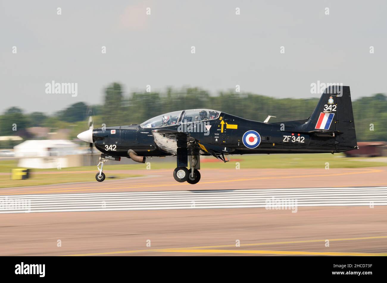 Royal Air Force, RAF, Short Tucano T1 landing at Royal International Air Tattoo airshow, RAF Fairford, UK. Turboprop trainer plane Stock Photo