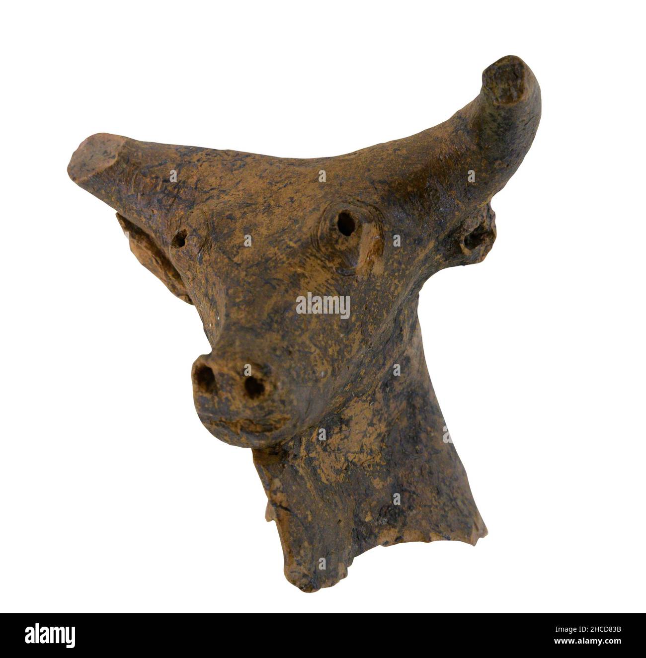 Neolithic pottery bull figure from Anatolia isolated on white Stock Photo