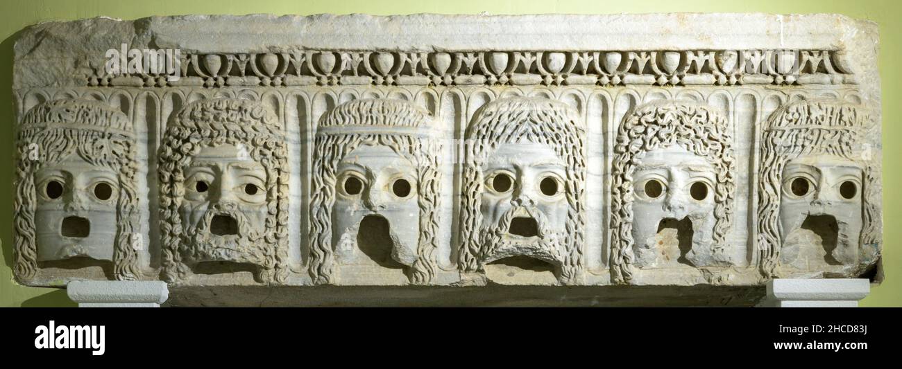 Ancient Greek theatrical masks - marble scenery of the entablature Stock Photo