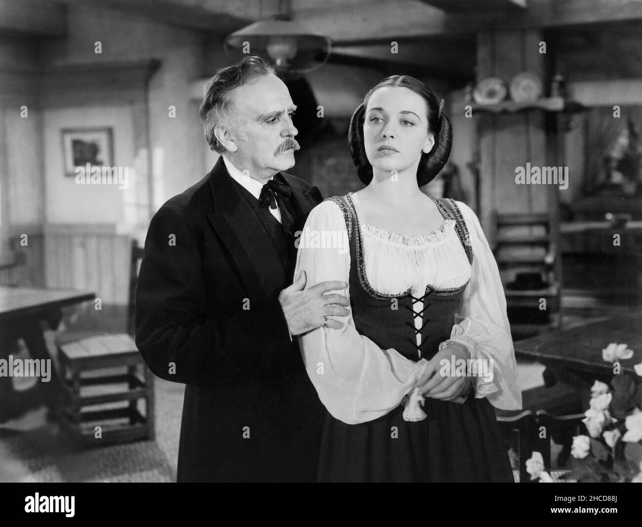 Ralph Morgan, Patricia Morison, on-set of the Film, 'Hitler's Madman', MGM, Loew's Inc., 1943 Stock Photo