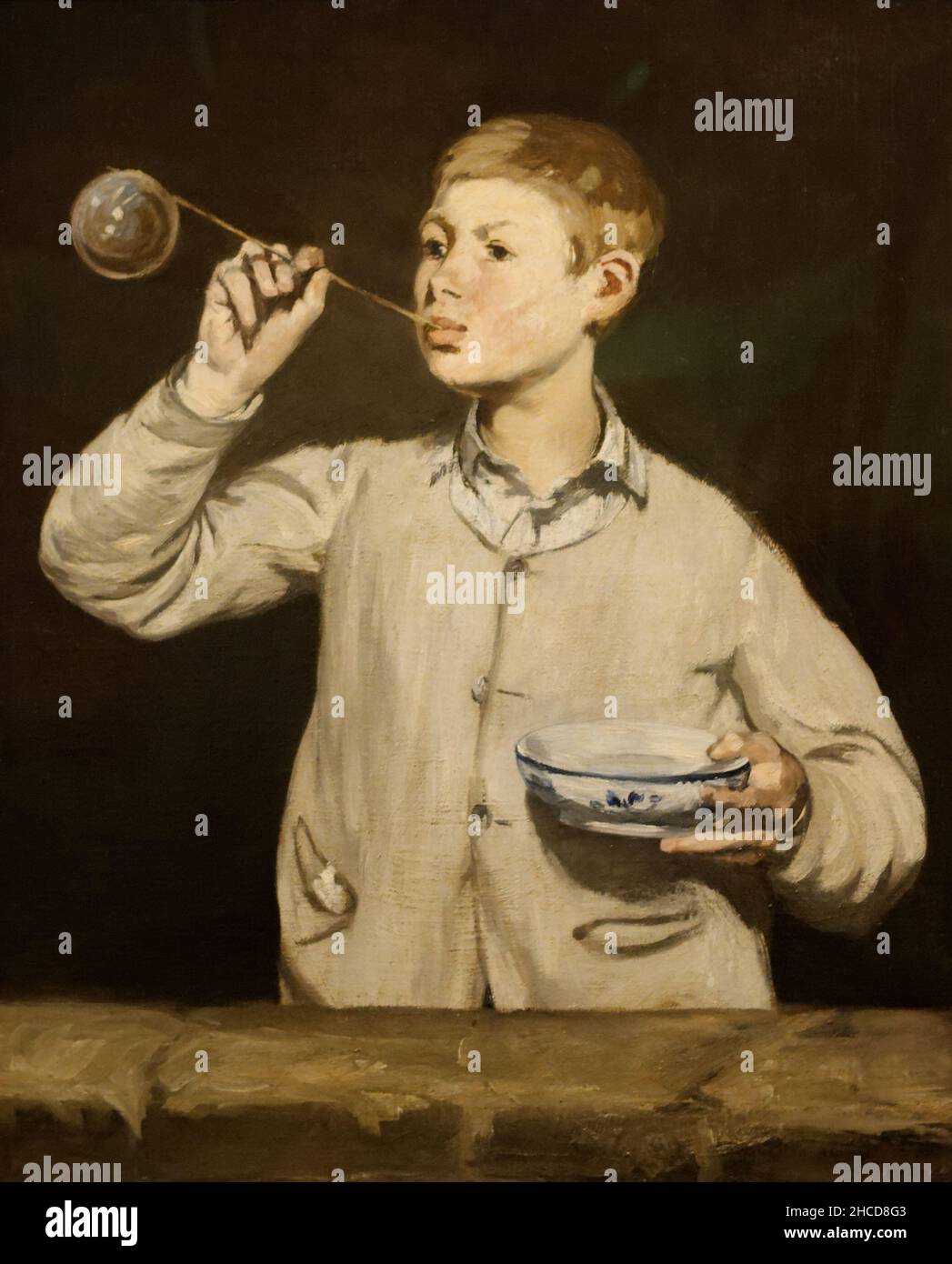 Boy Blowing Bubbles (also known as The Soap Bubbles; French: Les Bulles de savon) by Édouard Manet,. It shows Léon Koelin-Leenhoff, the illegitimate son (possibly fathered by Manet) of Manet's future wife, Suzanne Leenhoff. Bubbles are a symbol of the brevity of life. Stock Photo