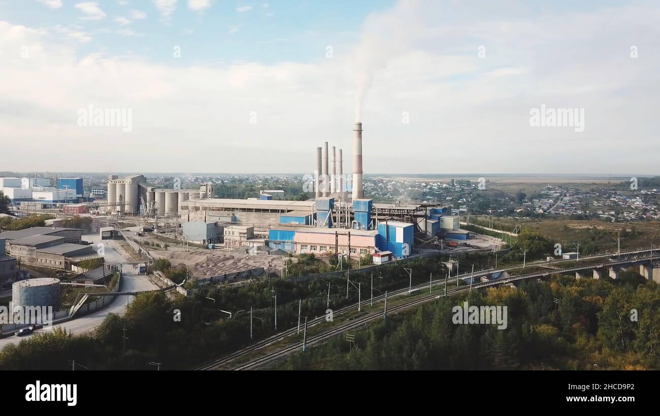 Industrial Area And Smoking Chimney On Power Plant Near The City