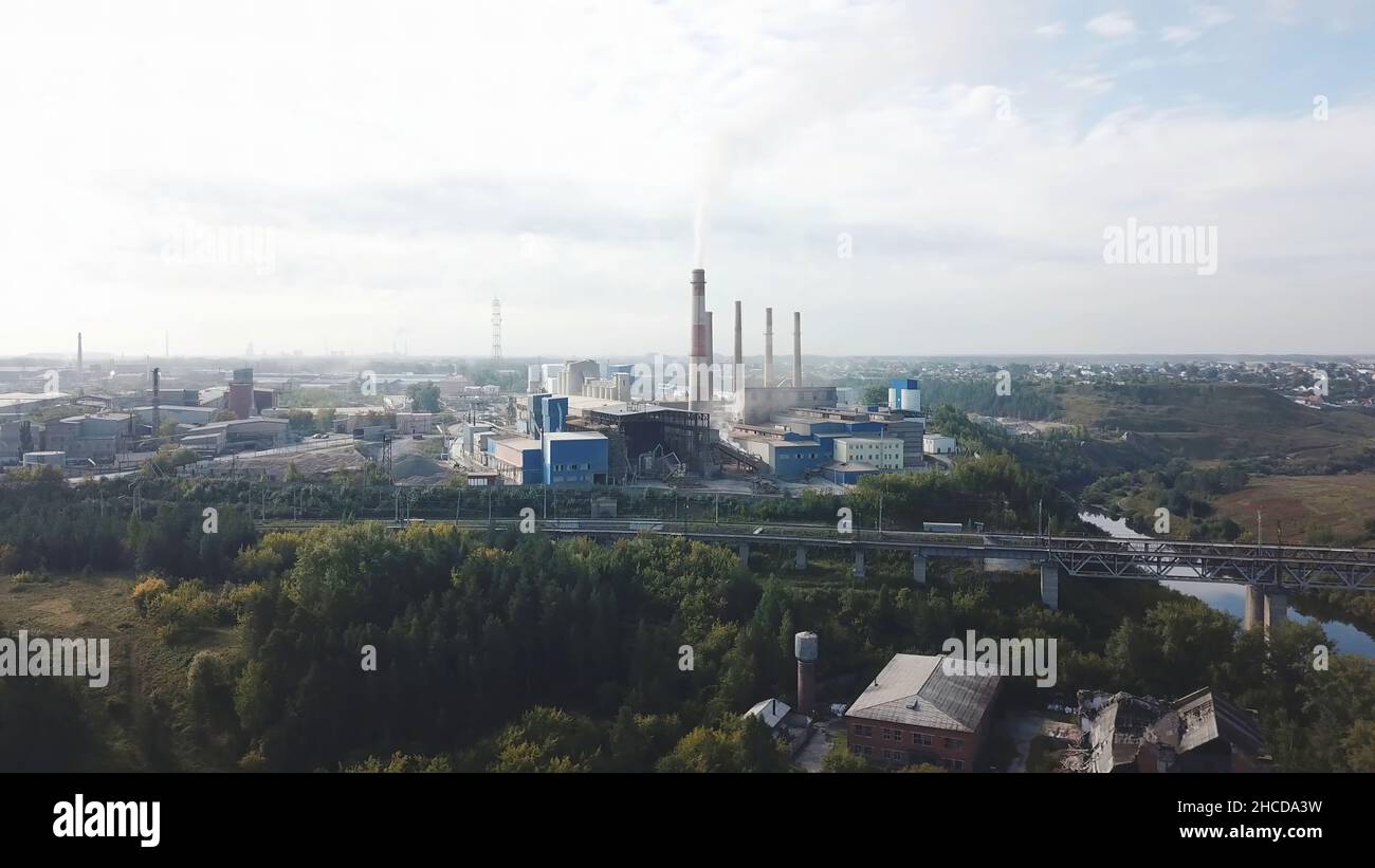 Industrial Area And Smoking Chimney On Power Plant Near The City
