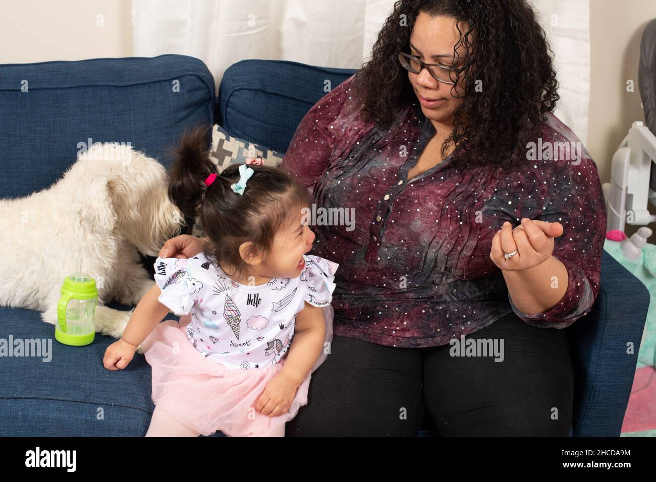 17 month old toddler girl with mother, crying, upset Stock Photo