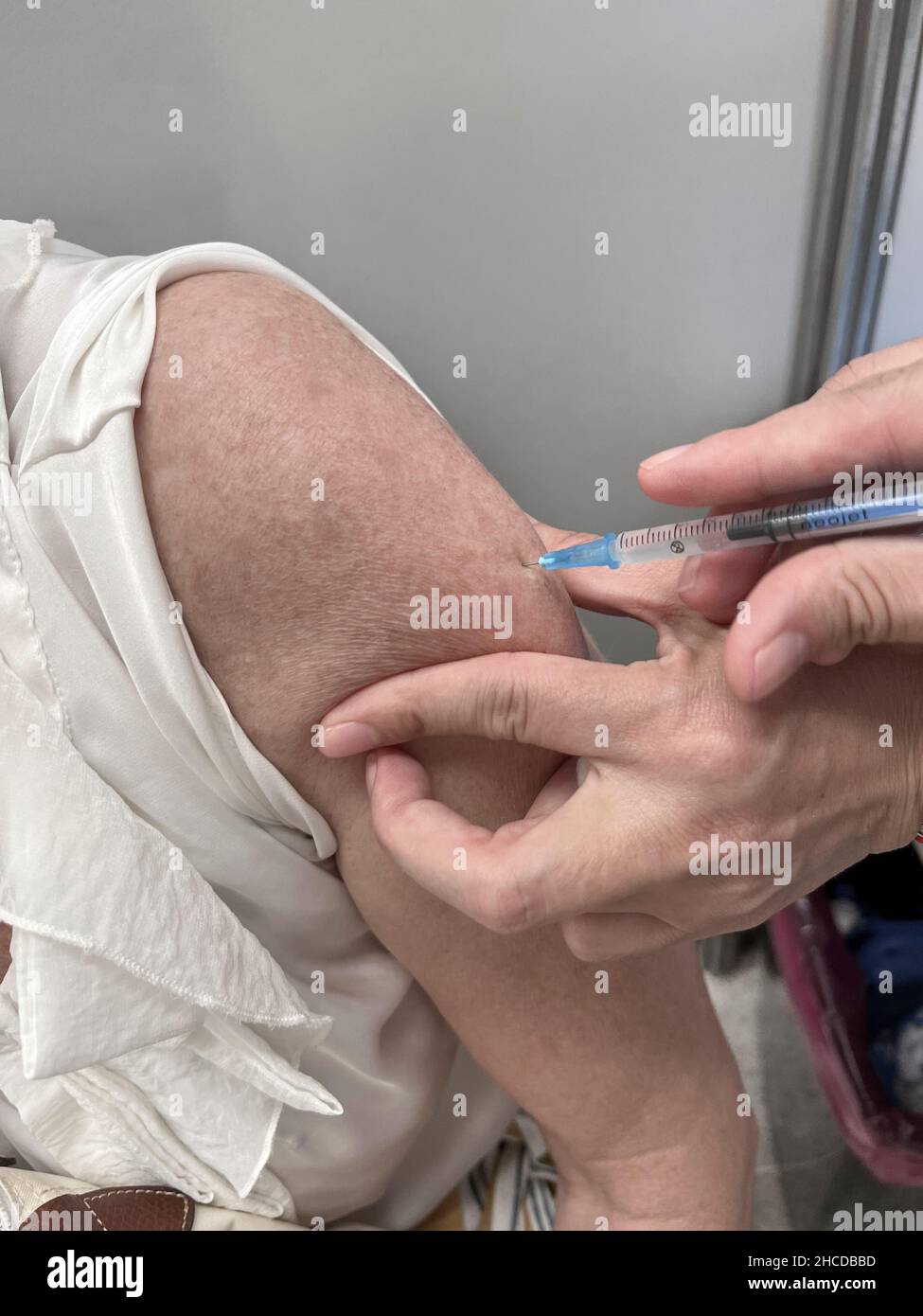 Vaccination jab in arm Stock Photo