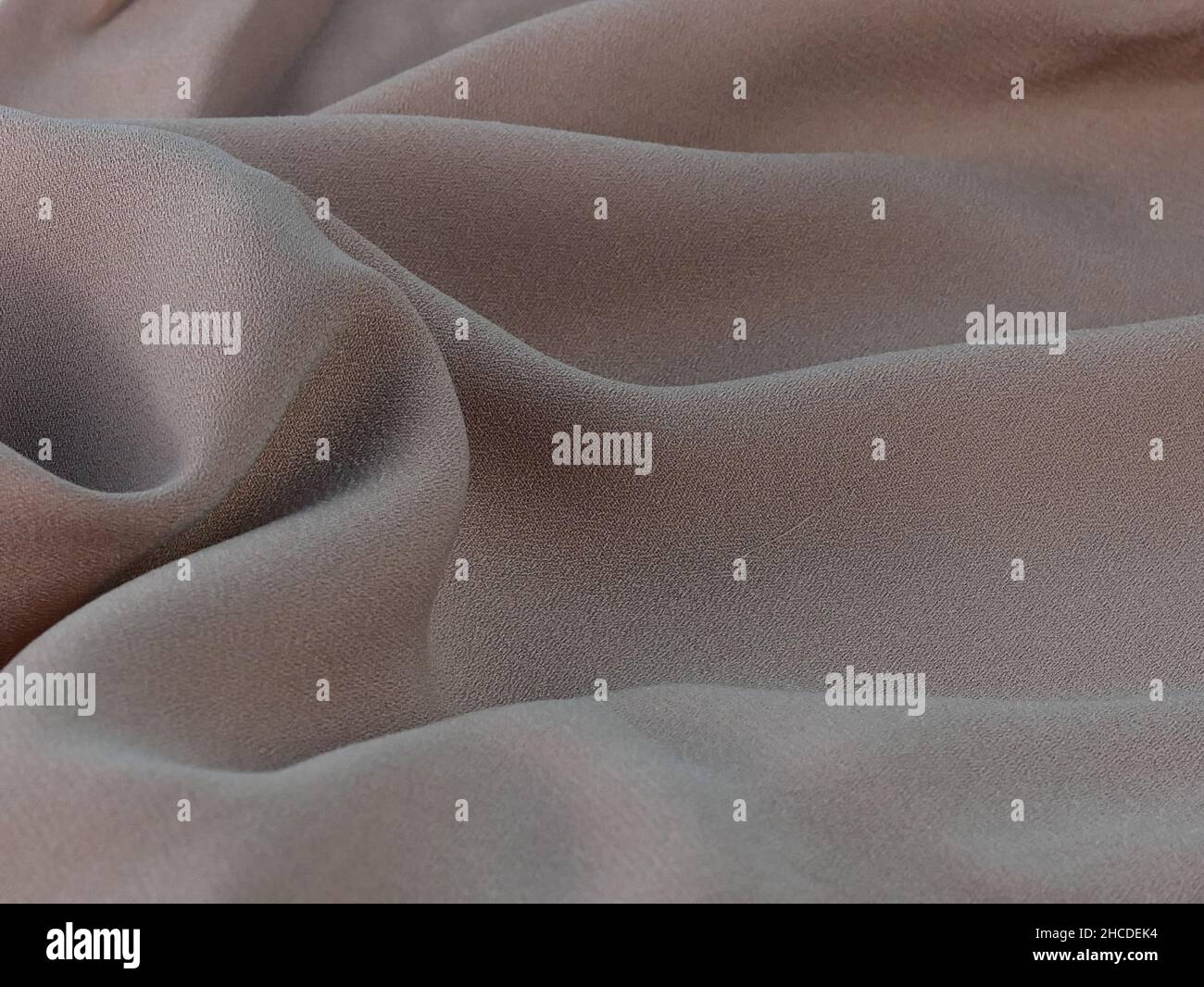 brown fabric texture, wrinkled fabric as a background. Stock Photo
