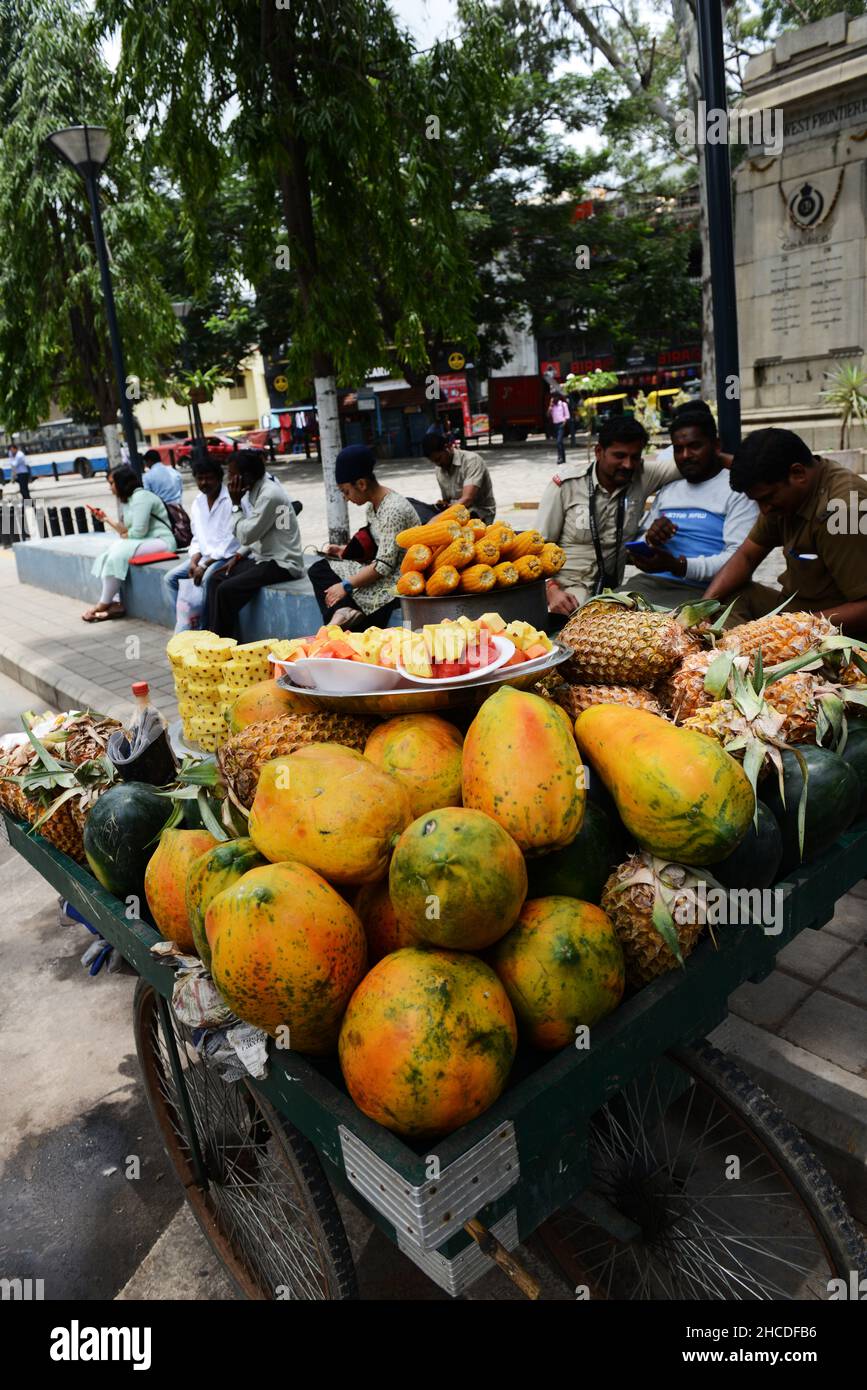A fresh fruit vendor selling fruit snacks in Bangalore, India Stock