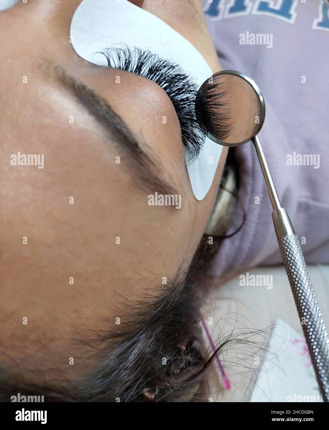 Lash extensions in beauty salon macro eye Stock Photo Alamy